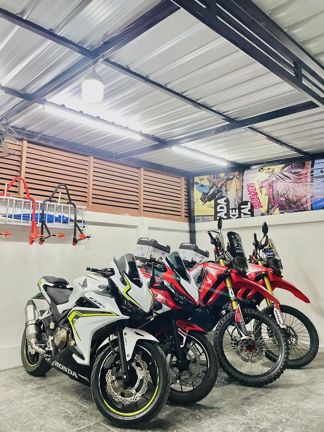 Honda CRF off-road motorbikes in the garage