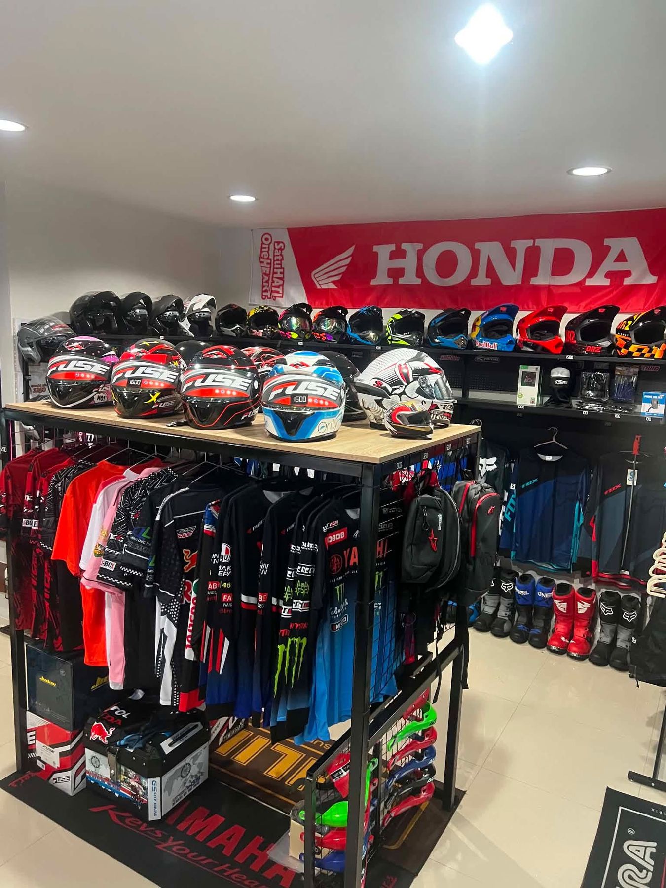 Gear shop wall with helmets, jerseys and boots