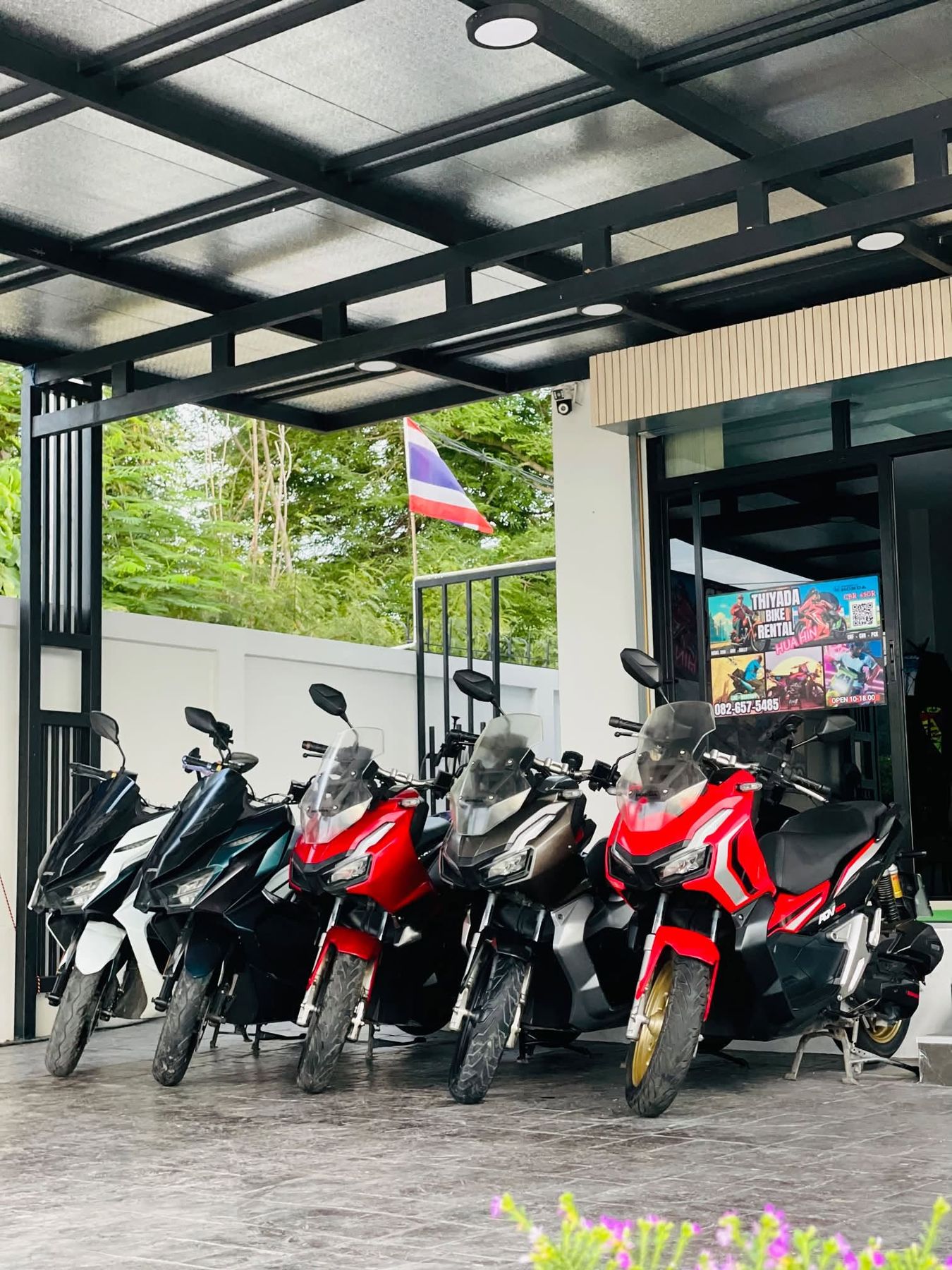 The Thiyada Bike Rental shopfront in Hua Hin with the fleet parked outside