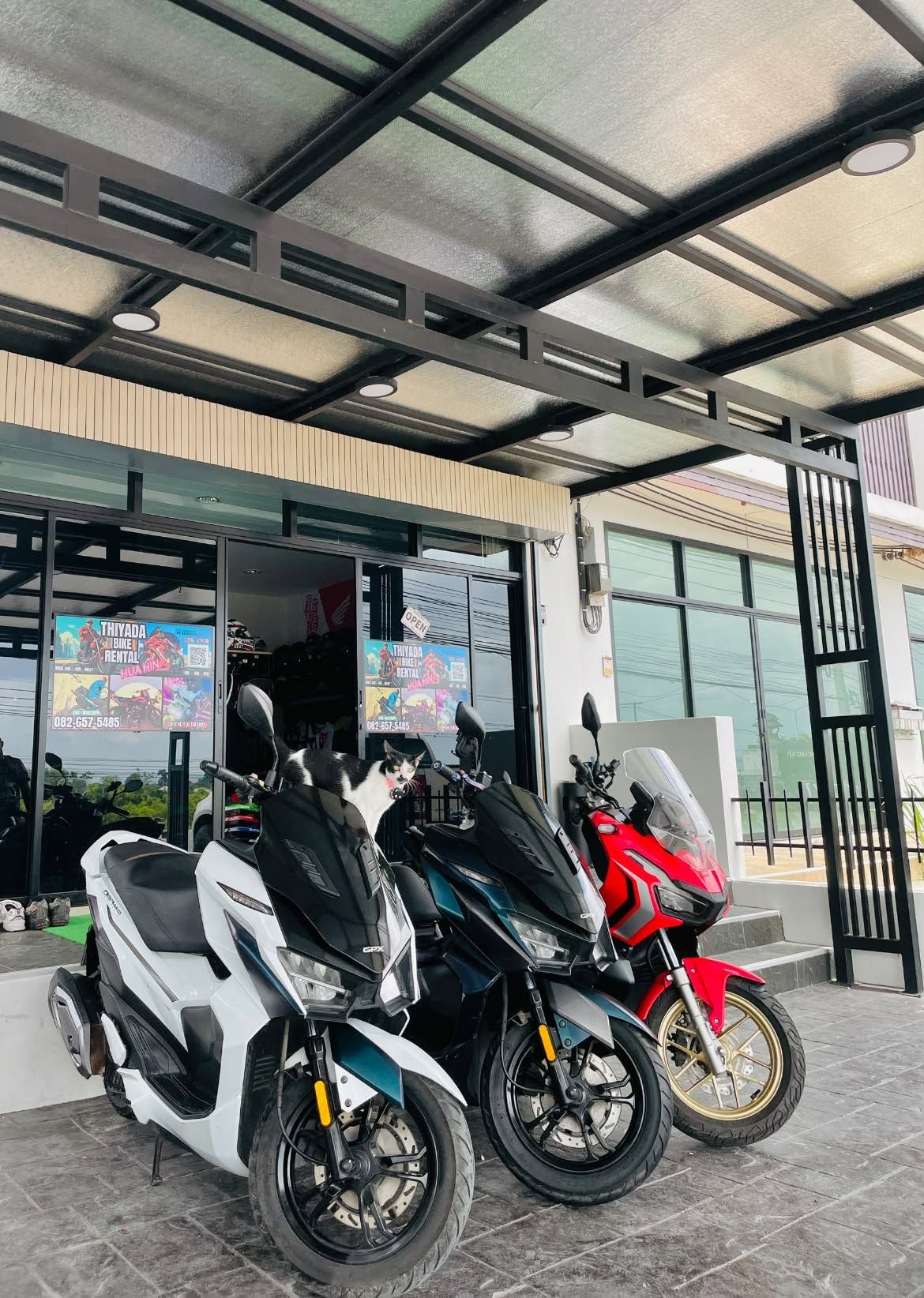 GPX and Honda automatic scooters parked outside the Thiyada shop